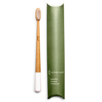 Truthbrush Soft Bamboo Toothbrush in Cloud White, Shown with Plastic Free Packaging.