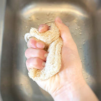ME Mother Earth Loofah Dish Sponge Squeezed Over Kitchen Sink.