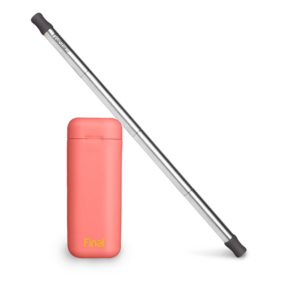 Final Straw Stainless Steel Reusable Straw Leaning Against Healthy Coral Case.