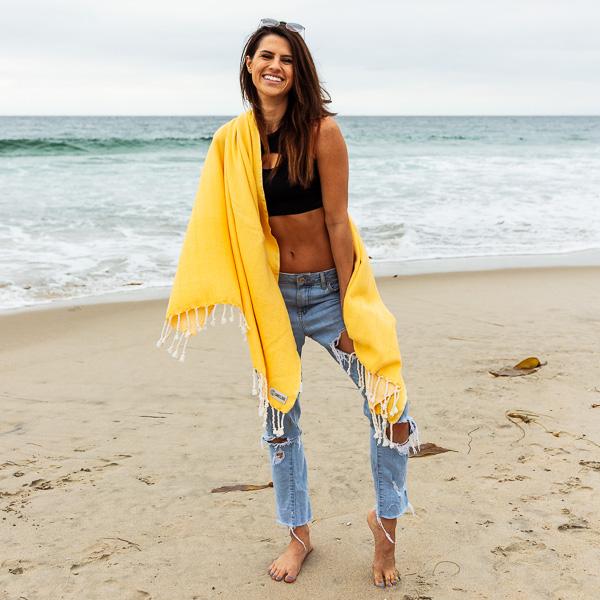 Sand Cloud Turkish Cotton Beach Travel Towel Wrapped Around Woman At Beach.