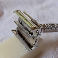 Rockwell Razor, Shown Resting On Shave Bar And Towel. Razor Head Open To Show Easy Blade Changing.